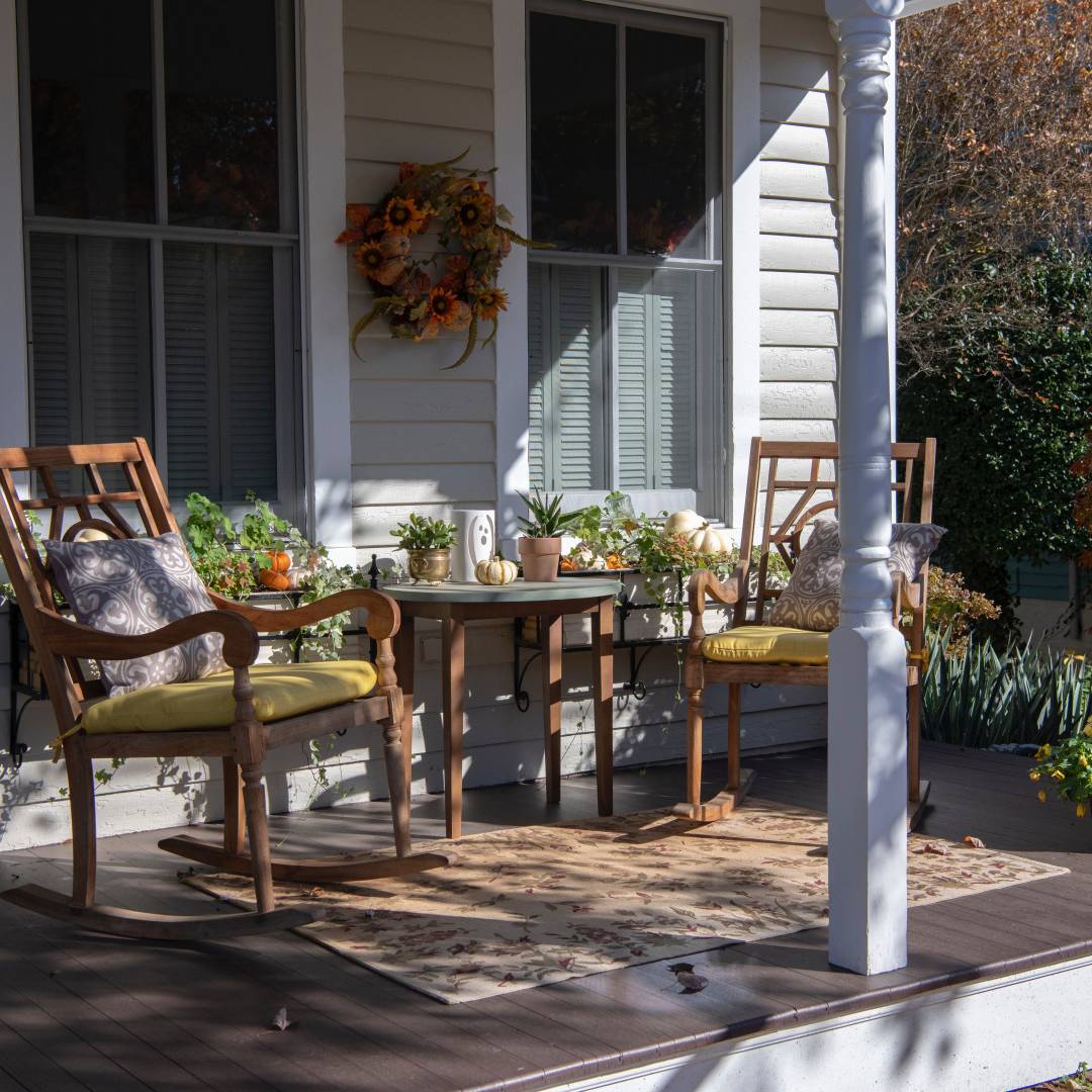 Consider the height of your porch and choose flower potters that will fit well