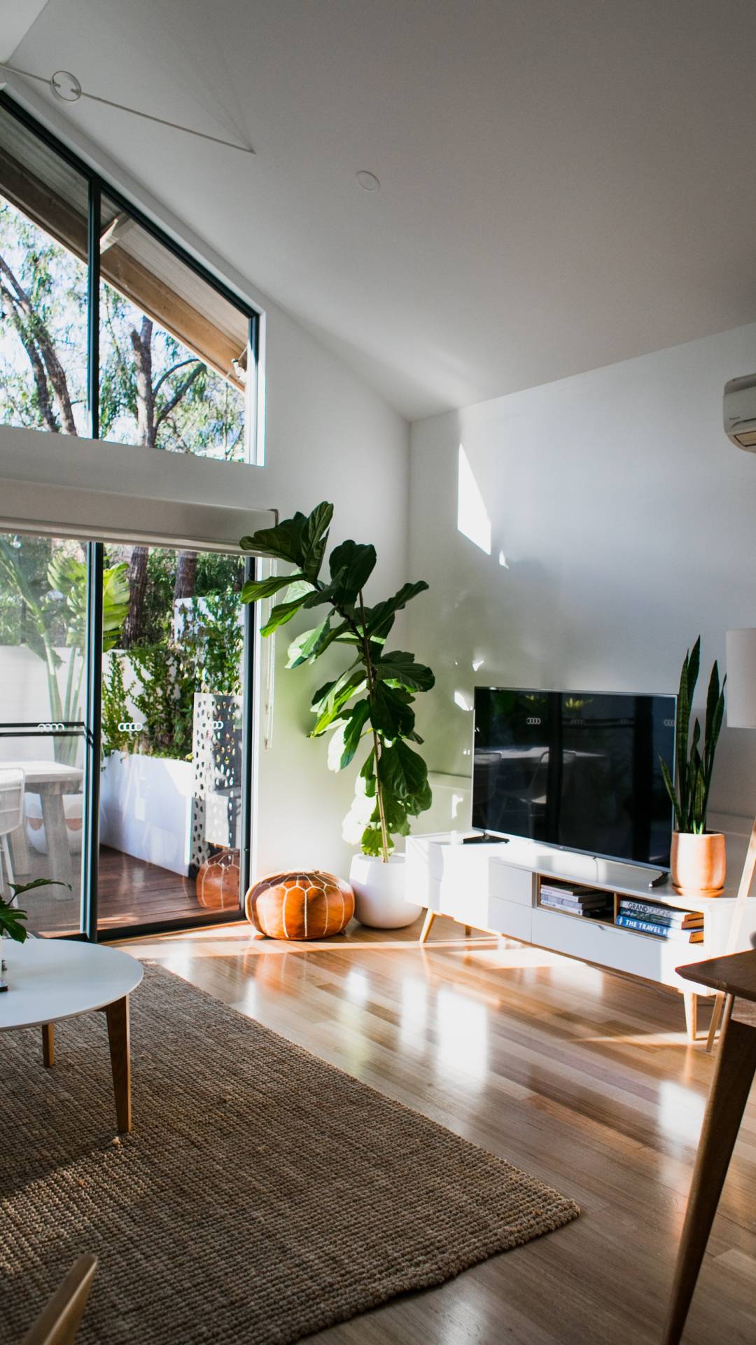 One of the key principles to keep in mind is that the rug should be large enough to anchor the furniture within a seating area. This means that all the front…